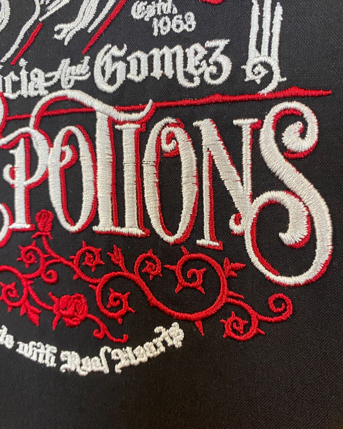 Love Potion Adams Embroidered Wall Art